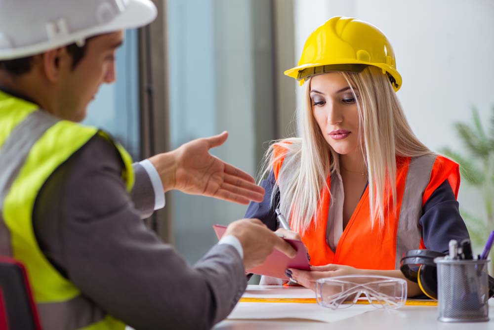 roofing contractors discussing work in an office