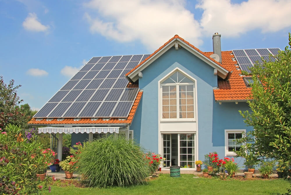 solar panels installed on a blue home