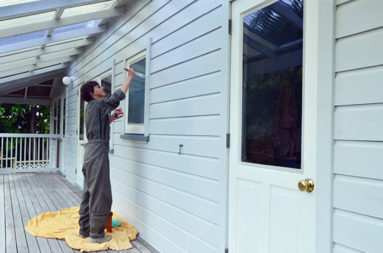 Woman Painting House