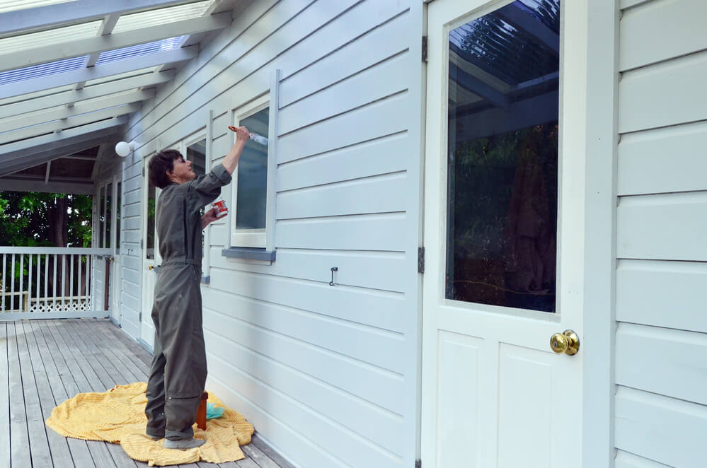 Woman Painting House